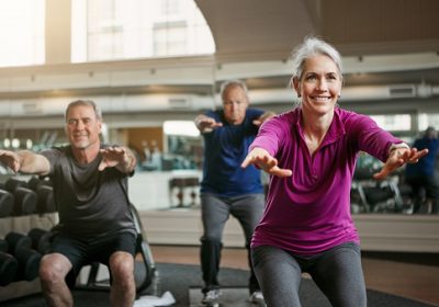 Shot of a senior group of woman and men working out together at the gym